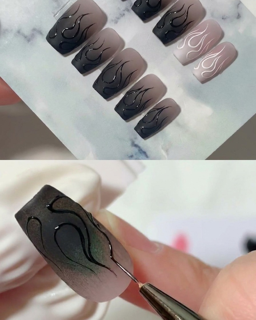 Nahaufnahme eines Liner-Pinsels, der vorsichtig eine scharfe Spitze an der Kante eines Flammendesigns auszieht.
