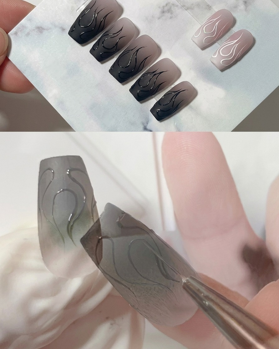 Makroaufnahme eines Liner-Pinsels, der die scharfe Spitze der mittleren Flamme auf einem matten grauen Nagel verfeinert.