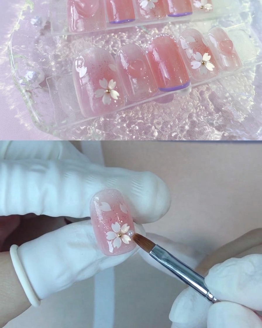 Ein Pinsel trägt eine zweite Schicht des Nude-Pfirsich-Gels auf einen Nagel auf.