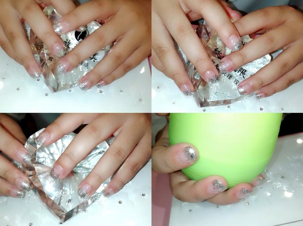 Verwendung einer Präzisionspinzette, um kleine klare Kristalle nahe der Nagelhautlinie zu platzieren.