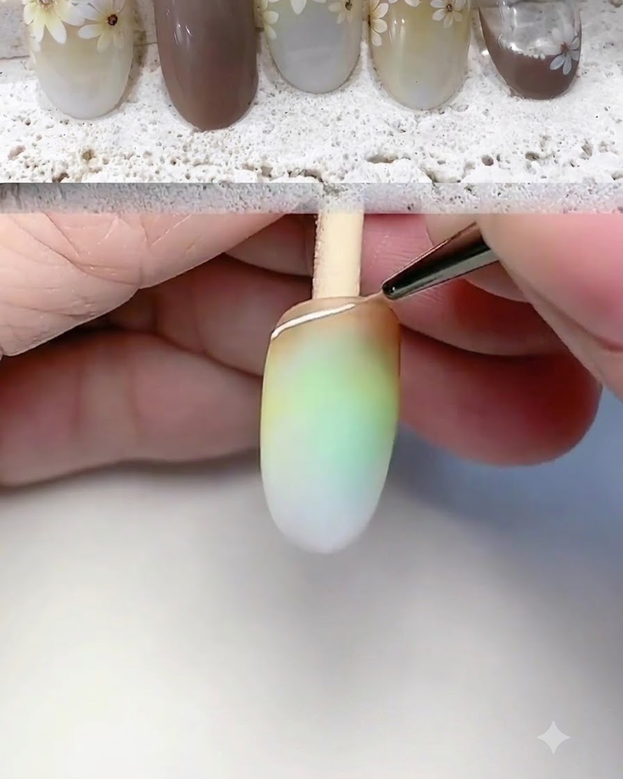 Ein feiner Liner-Pinsel zeichnet eine weiße Umrisslinie und Basislinie an der Nagelspitze.