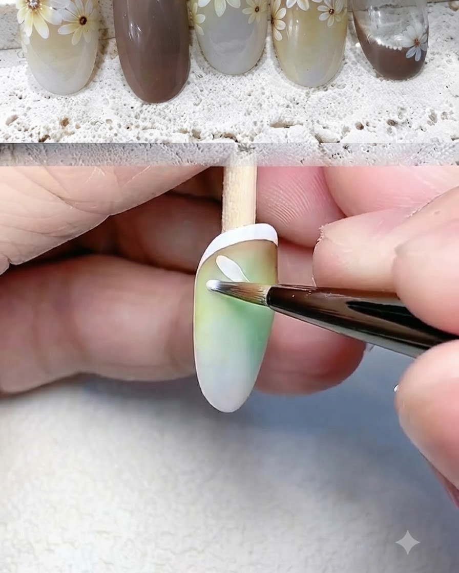 Ein feiner Liner-Pinsel malt einzelne weiße Blütenblätter für eine Gänseblümchenblüte auf den Nagel.