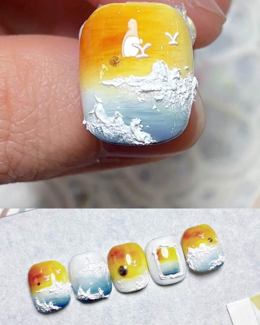 Ein Pinsel trägt Top Coat über ein fertiges Sonnenuntergang-Gradient-Nail-Art-Design auf.