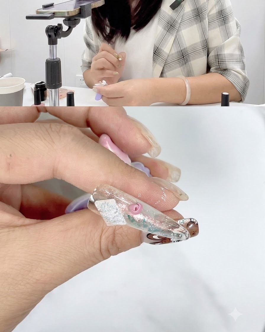 Nahaufnahme eines Nagels mit teilweise fertiggestellten Rosenblättern, die unter einer Nagellampe aushärten.