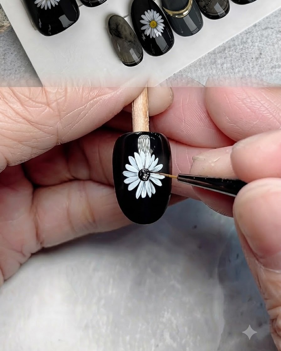 Ein feiner Pinsel trägt schwarzes Gel auf das Zentrum des gemalten Gänseblümchens auf.